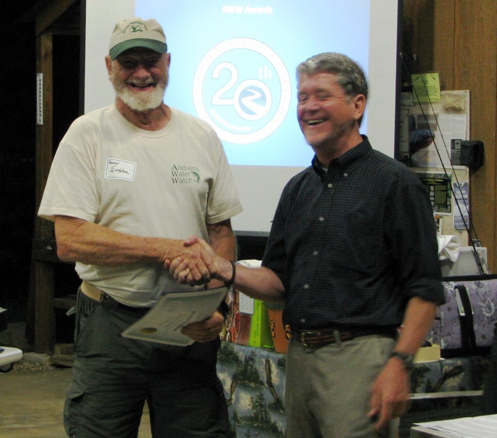 Homer receiving the AWW Trainer Of The Year Award from Dr. Deutsch in 2013.