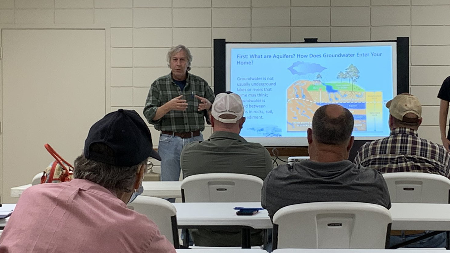 The Director of the Groundwater Assessment Program of the Geological Survey of Alabama (GSA), Greg Guthrie, speaks with private well owners.